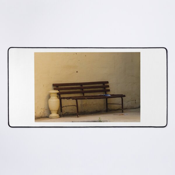 Item preview, Empty Rustic Bench Against a Weathered Wall in a Quiet Urban Corner designed and sold by Nmallia.