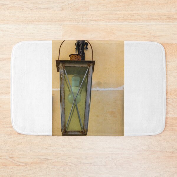 Item preview, Vintage Wall Lantern With Bulb and Rusted Metal Fixture Against Beige Tiled Wall designed and sold by Nmallia.