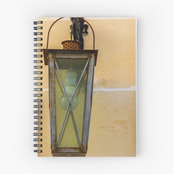 Item preview, Vintage Wall Lantern With Bulb and Rusted Metal Fixture Against Beige Tiled Wall designed and sold by Nmallia.
