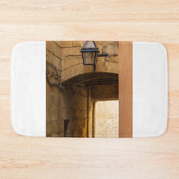 Item preview, Old Stone Alley Lantern Over Arched Passageway With Weathered Walls And Warm Light designed and sold by Nmallia.
