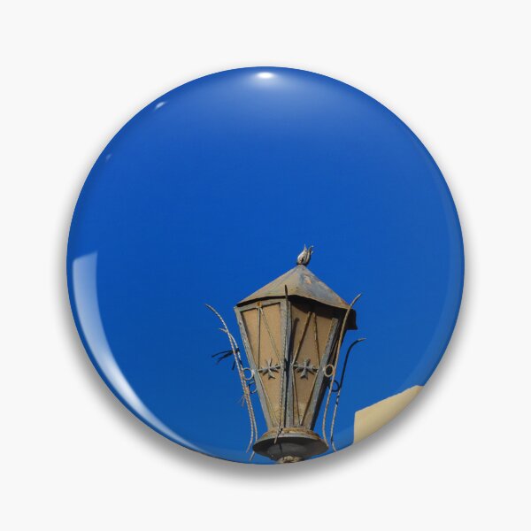 Item preview, Rustic Street Lamp Against a Bright Blue Sky and Modern Architecture designed and sold by Nmallia.