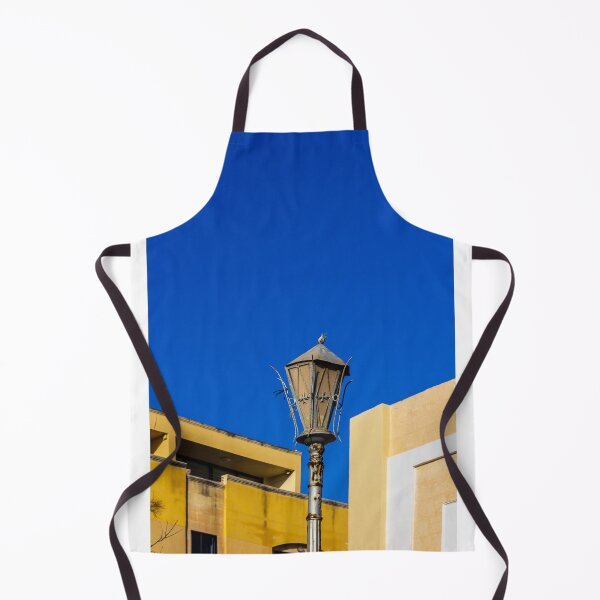 Item preview, Rustic Street Lamp Against a Bright Blue Sky and Modern Architecture designed and sold by Nmallia.