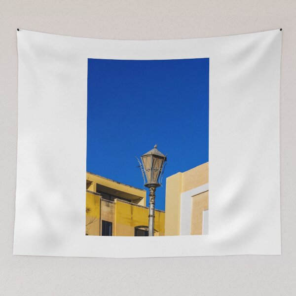 Item preview, Rustic Street Lamp Against a Bright Blue Sky and Modern Architecture designed and sold by Nmallia.