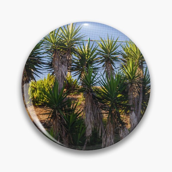 Item preview, Tropical Yucca Plants Growing Along a Hillside Under a Clear Blue Sky designed and sold by Nmallia.