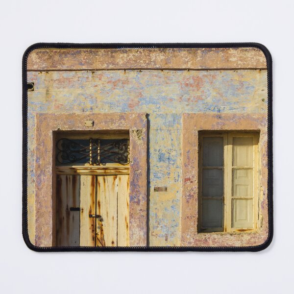 Item preview, Vintage Stone Building with Worn Doors and Windows in Bright Sunlight designed and sold by Nmallia.
