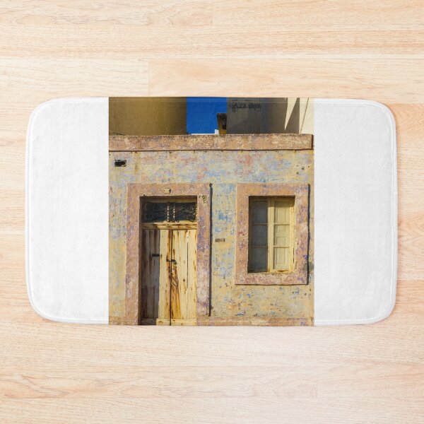 Item preview, Vintage Stone Building with Worn Doors and Windows in Bright Sunlight designed and sold by Nmallia.