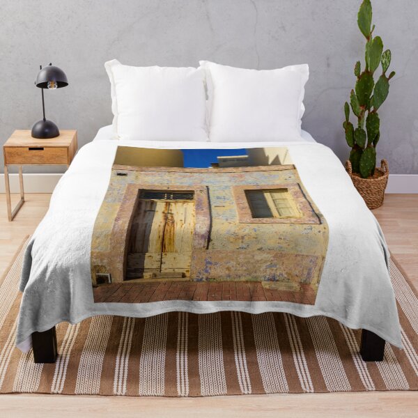 Item preview, Vintage Stone Building with Worn Doors and Windows in Bright Sunlight designed and sold by Nmallia.