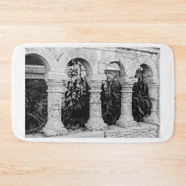 Item preview, Black and White Arched Columns of a Rustic Stone Structure With Leafy Background designed and sold by Nmallia.