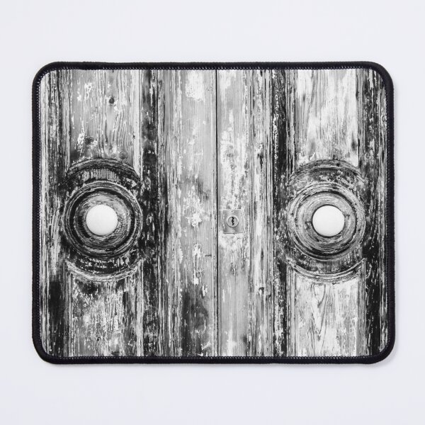 Item preview, Closeup of Weathered Wooden Doors in a Black and White Composition designed and sold by Nmallia.