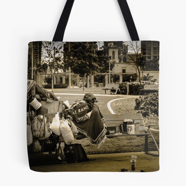 Item preview, A person with their personal belongings in an urban park designed and sold by By Sanata Photography.