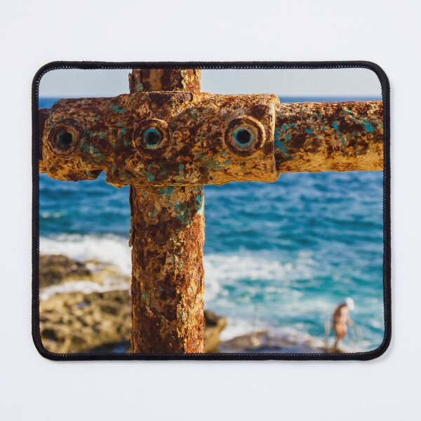 Item preview, Rusty Metal Rail with Ocean Background and Person on Rocky Shore designed and sold by Nmallia.