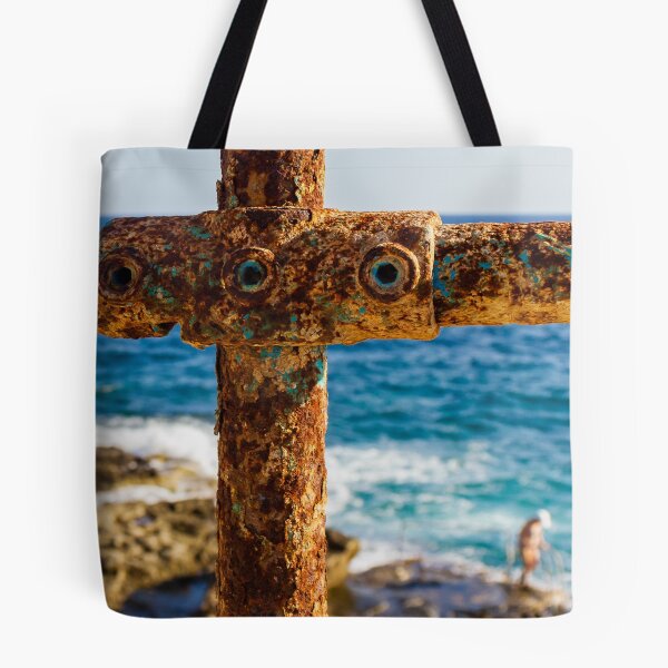 Item preview, Rusty Metal Rail with Ocean Background and Person on Rocky Shore designed and sold by Nmallia.