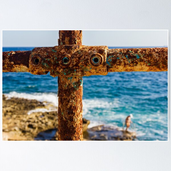 Item preview, Rusty Metal Rail with Ocean Background and Person on Rocky Shore designed and sold by Nmallia.