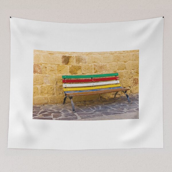 Item preview, Colorful Painted Bench Against Rustic Stone Wall On Sunny Mediterranean Street designed and sold by Nmallia.