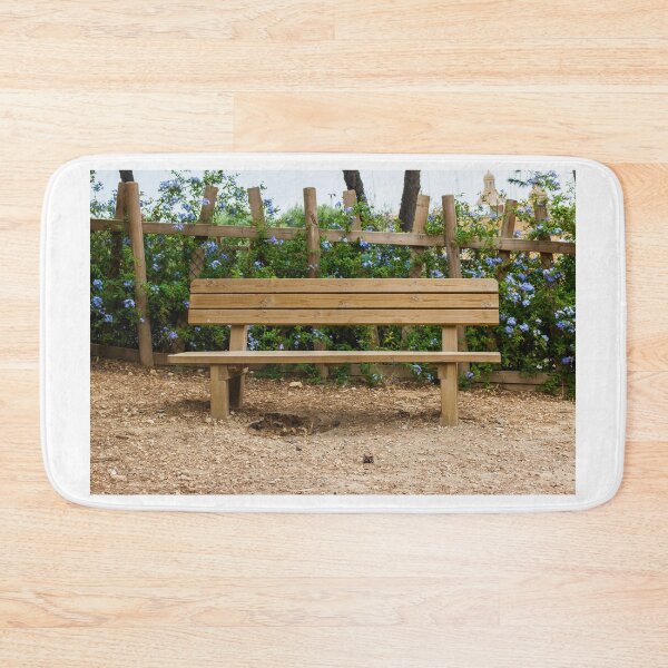 Item preview, Wooden Bench in a Peaceful Garden Surrounded by Purple Flowers and Shrubs designed and sold by Nmallia.