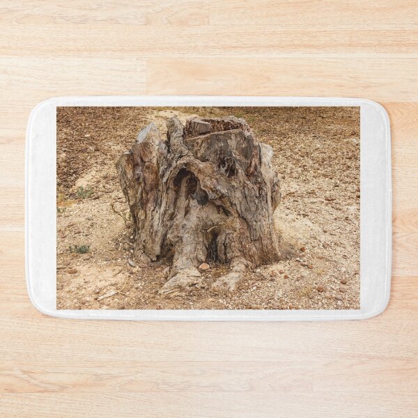Item preview, Aged Tree Stump in a Dry Arid Landscape Reflecting Nature's Resilience designed and sold by Nmallia.