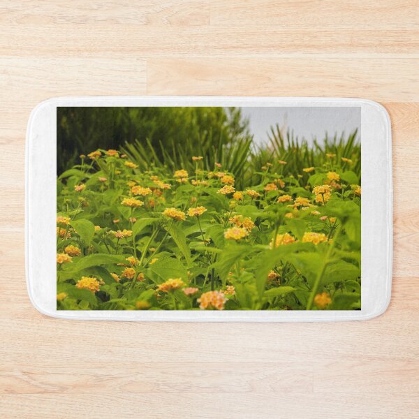 Item preview, Beautiful Yellow Flower Blossoms in a Vibrant Green Garden Landscape designed and sold by Nmallia.