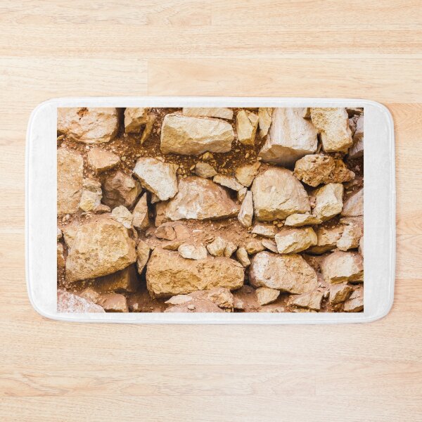 Item preview, Close-Up Rustic Stone Wall With Weathered Rocks And Earthy Texture For Backgrounds designed and sold by Nmallia.
