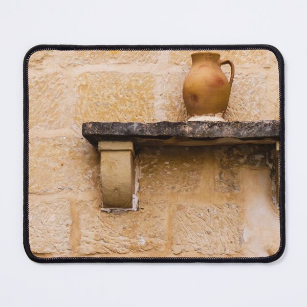 Item preview, Earthenware Jug On Stone Shelf Against Weathered Sandstone Wall In Mediterranean Village designed and sold by Nmallia.