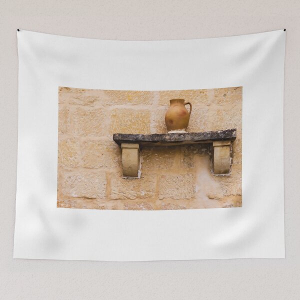 Item preview, Earthenware Jug On Stone Shelf Against Weathered Sandstone Wall In Mediterranean Village designed and sold by Nmallia.