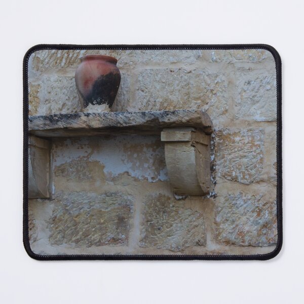 Item preview, Earthenware Jug On Stone Shelf Against Weathered Sandstone Wall In Mediterranean Village designed and sold by Nmallia.