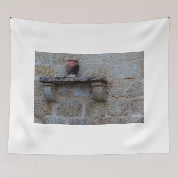 Item preview, Earthenware Jug On Stone Shelf Against Weathered Sandstone Wall In Mediterranean Village designed and sold by Nmallia.