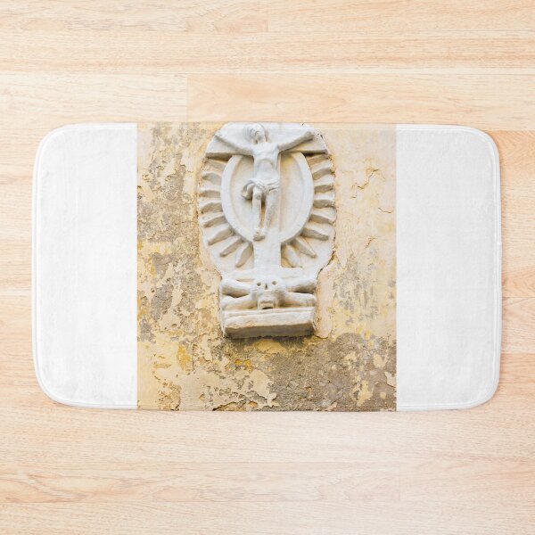 Item preview, White Crucifix Relief With Skull Sculpture On Weathered Yellow Wall Symbolizing Faith And Mortality designed and sold by Nmallia.