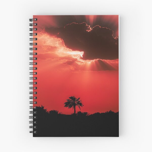 Item preview, Fiery Sunset Sky with Sun Rays Behind Dark Clouds Silhouette designed and sold by AbulailArt.