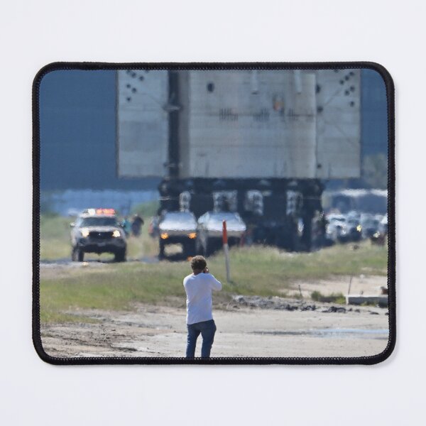 Item preview, A photographer gets dwarfed by the SpaceX Booster 15.2 at Starbase designed and sold by STFPhotoAgency.