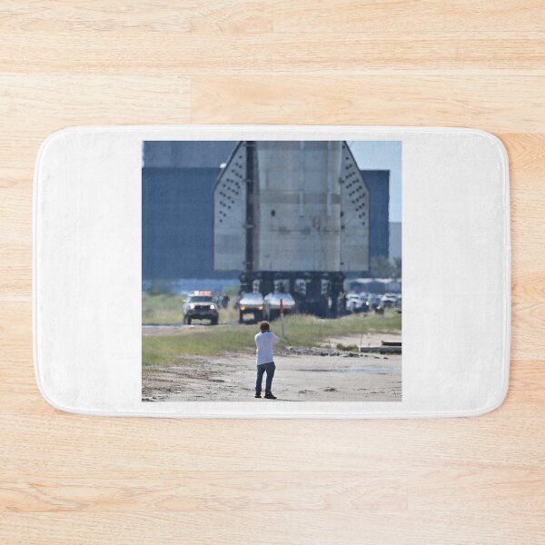 Item preview, A photographer gets dwarfed by the SpaceX Booster 15.2 at Starbase designed and sold by STFPhotoAgency.