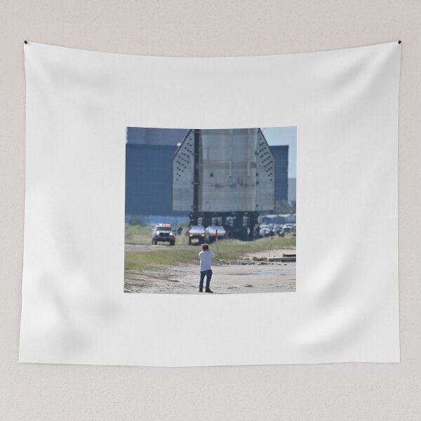 Item preview, A photographer gets dwarfed by the SpaceX Booster 15.2 at Starbase designed and sold by STFPhotoAgency.