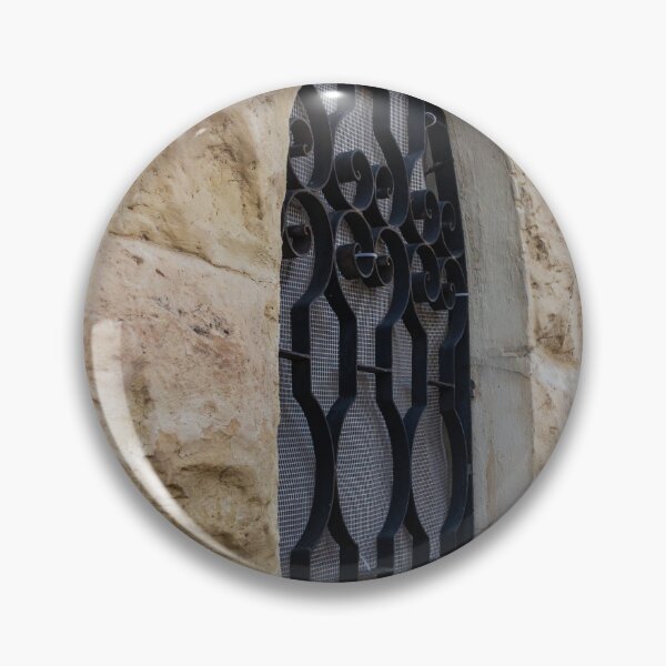 Item preview, Rustic Stone Wall With Arched Window And Decorative Iron Bars On Exterior Building designed and sold by Nmallia.