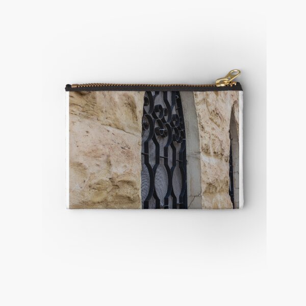 Item preview, Rustic Stone Wall With Arched Window And Decorative Iron Bars On Exterior Building designed and sold by Nmallia.