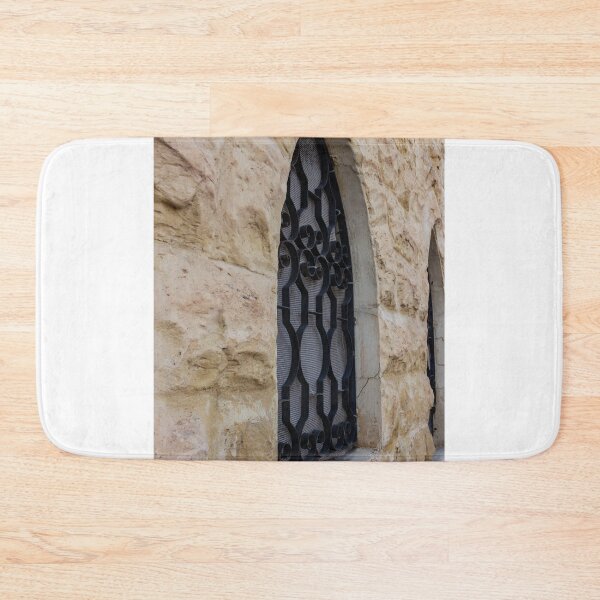 Item preview, Rustic Stone Wall With Arched Window And Decorative Iron Bars On Exterior Building designed and sold by Nmallia.