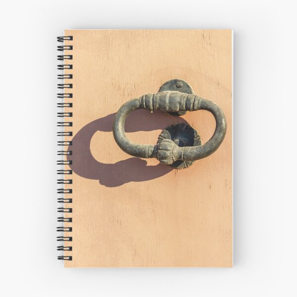 Item preview, Antique Iron Door Knocker On Peach Wooden Door With Shadow In Bright Sunlight Texture designed and sold by Nmallia.