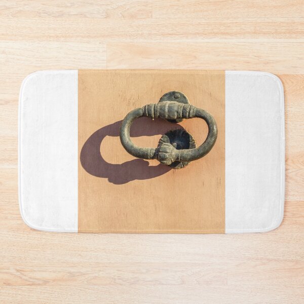 Item preview, Antique Iron Door Knocker On Peach Wooden Door With Shadow In Bright Sunlight Texture designed and sold by Nmallia.
