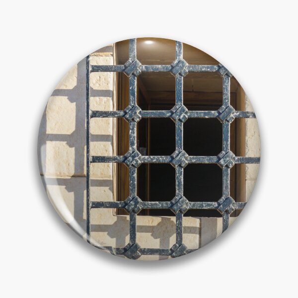 Item preview, Intricate Iron Window Grille Over Beige Stone Wall Casting Long Shadow in Warm Sunlight designed and sold by Nmallia.