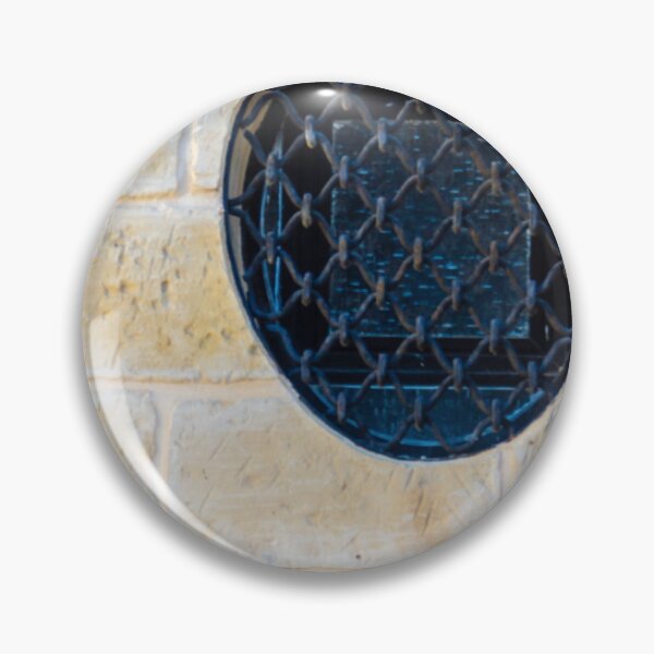 Item preview, Circular Metal Grate Over Window in Beige Stone Wall Creates Historic, Industrial Detail designed and sold by Nmallia.