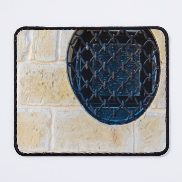 Item preview, Circular Metal Grate Over Window in Beige Stone Wall Creates Historic, Industrial Detail designed and sold by Nmallia.