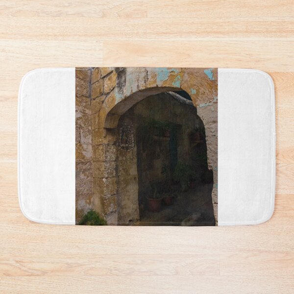 Item preview, Weathered Stone Archway Leading Into Shaded Mediterranean Courtyard With Potted Plants And Peeling Paint designed and sold by Nmallia.