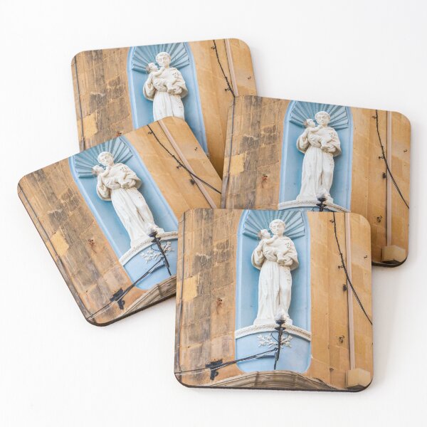 Item preview, White Saint Statue Holding Child in Blue Niche on Weathered Church Facade, Religious Architectural Detail designed and sold by Nmallia.
