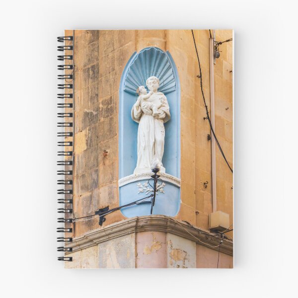 Item preview, White Saint Statue Holding Child in Blue Niche on Weathered Church Facade, Religious Architectural Detail designed and sold by Nmallia.