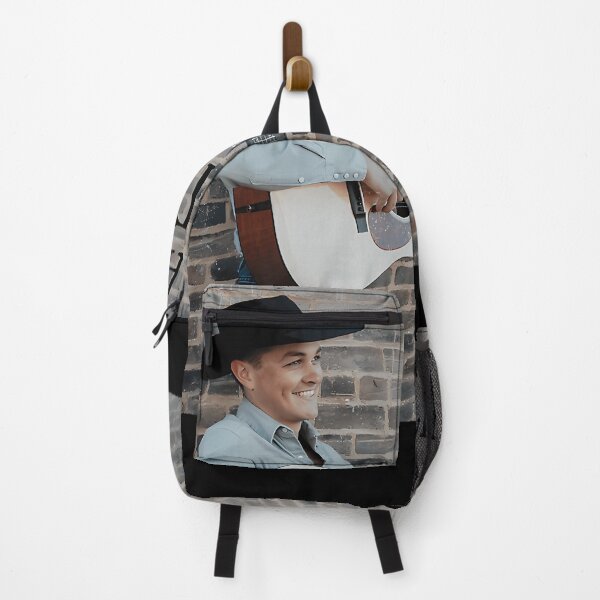 Item preview, CoMan In Cowboy Hat Playing Acoustic Guitar Against Brick Wall designed and sold by Isaac Anene.