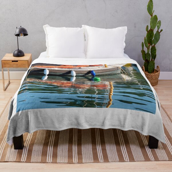 Item preview, Small Sailboat with Colourful Reflections Anchored in Calm Harbour Waters designed and sold by Dorset Girl.