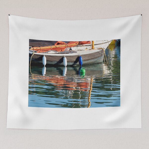 Item preview, Small Sailboat with Colourful Reflections Anchored in Calm Harbour Waters designed and sold by Dorset Girl.