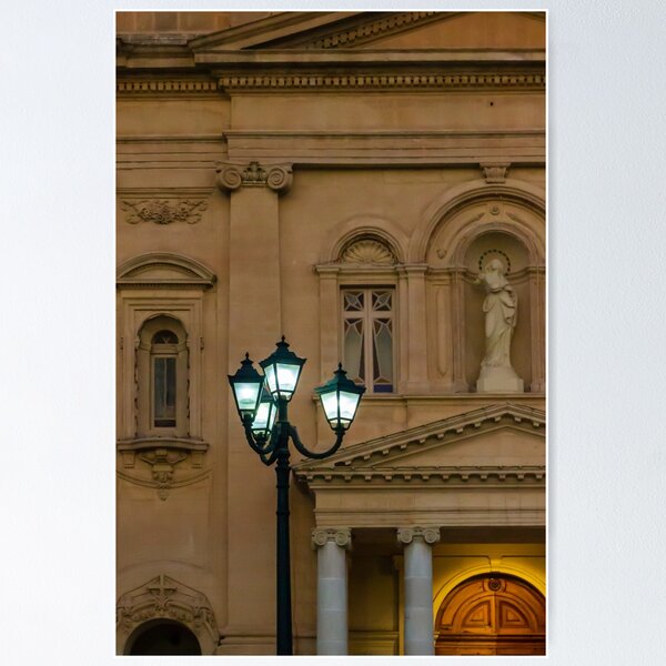 Item preview, Glowing Street Lamp in Front of Historic Classical Building With Statue and Columns at Night designed and sold by Nmallia.