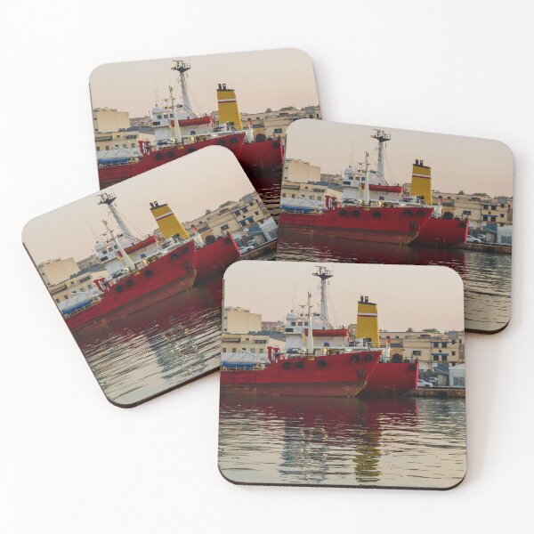 Item preview, Red Cargo Ship Docked at Industrial Harbor With Evening Reflections on Calm Water designed and sold by Nmallia.