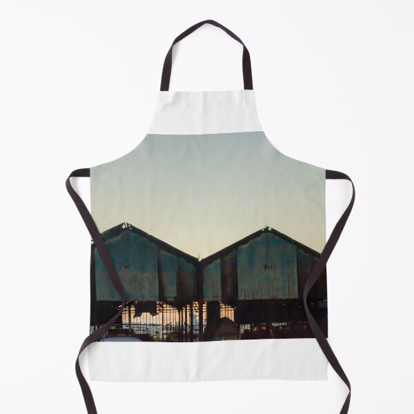 Item preview, Silhouetted Rusted Warehouse Sheds Along Waterfront At Sunset With Dusk Sky and Pier Structures designed and sold by Nmallia.