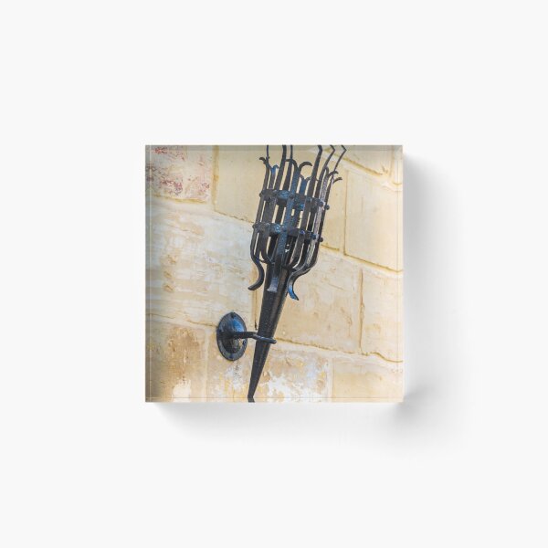Item preview, Antique Black Iron Wall Torch with Spiked Holder Mounted on Rustic Stone Wall designed and sold by Nmallia.