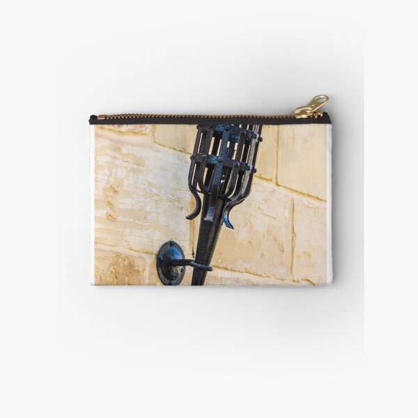 Item preview, Antique Black Iron Wall Torch with Spiked Holder Mounted on Rustic Stone Wall designed and sold by Nmallia.